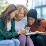 group of friends looking at mobile