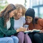 group of friends looking at mobile
